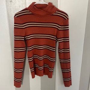 Fashion Nova- Call It Out Turtleneck Sweater - Rust/combo
Size: 1X
